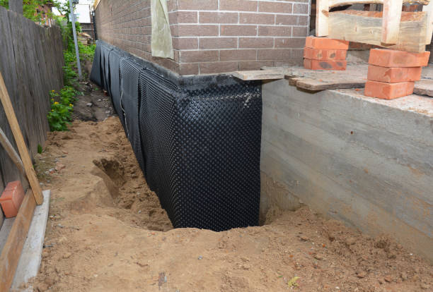 Happy homeowners after waterproofing job in Fairview